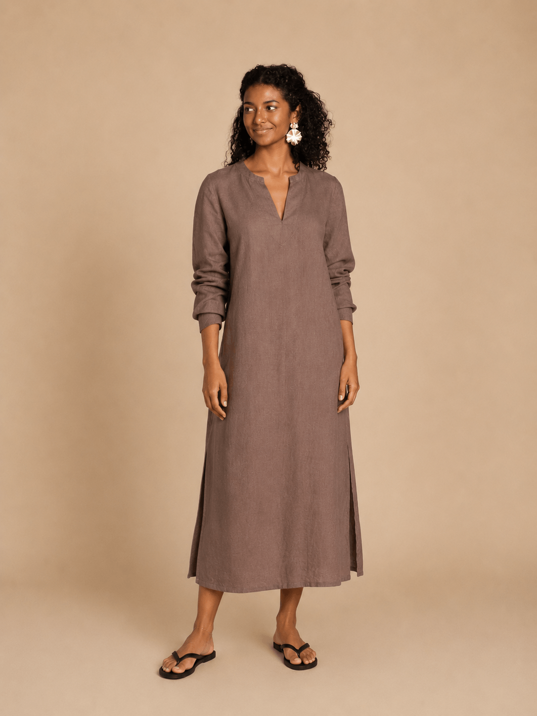 Piper Tunic sewing pattern seen in chocolate brown linen on a model against a tan background